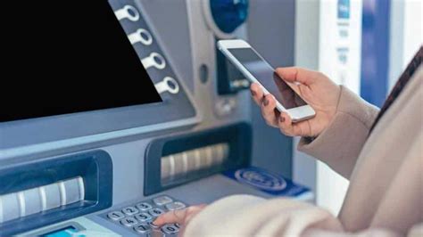 To use QR codes with a cardless ATM, your banking app will usually provide a specialized QR code on the app. Once the QR code is showing on the phone screen, turn it toward the ATM in a specified area to allow an ATM camera to scan the code and verify your identity. Demand-generated QR codes cannot be read or deciphered visually by humans. 